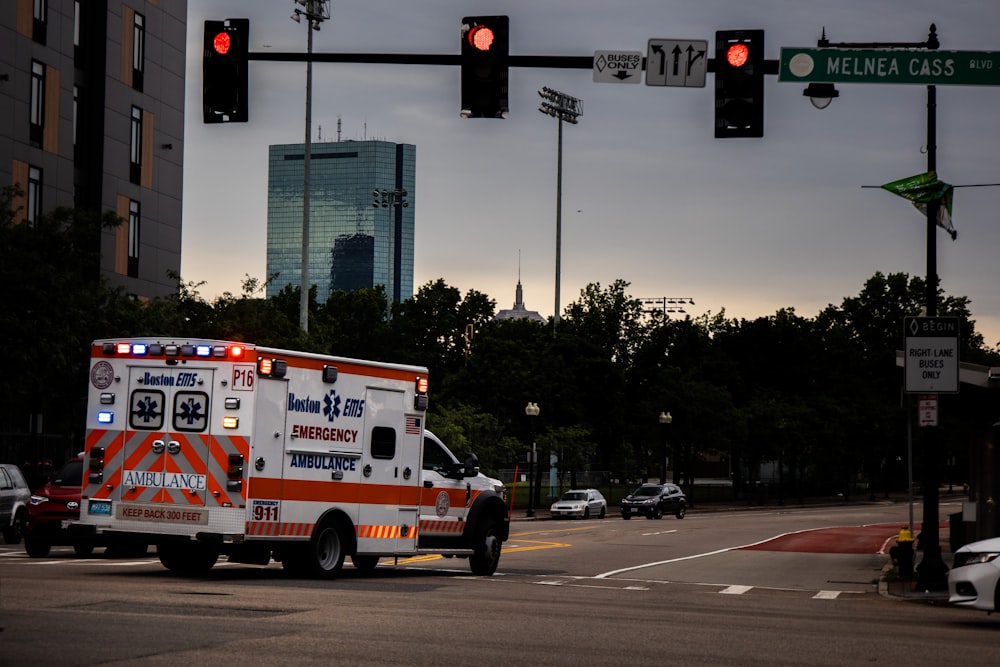 white and red fire truck on road during daytime