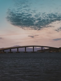 A serene landscape with a bridge leading into the horizon, symbolizing connection and growth.