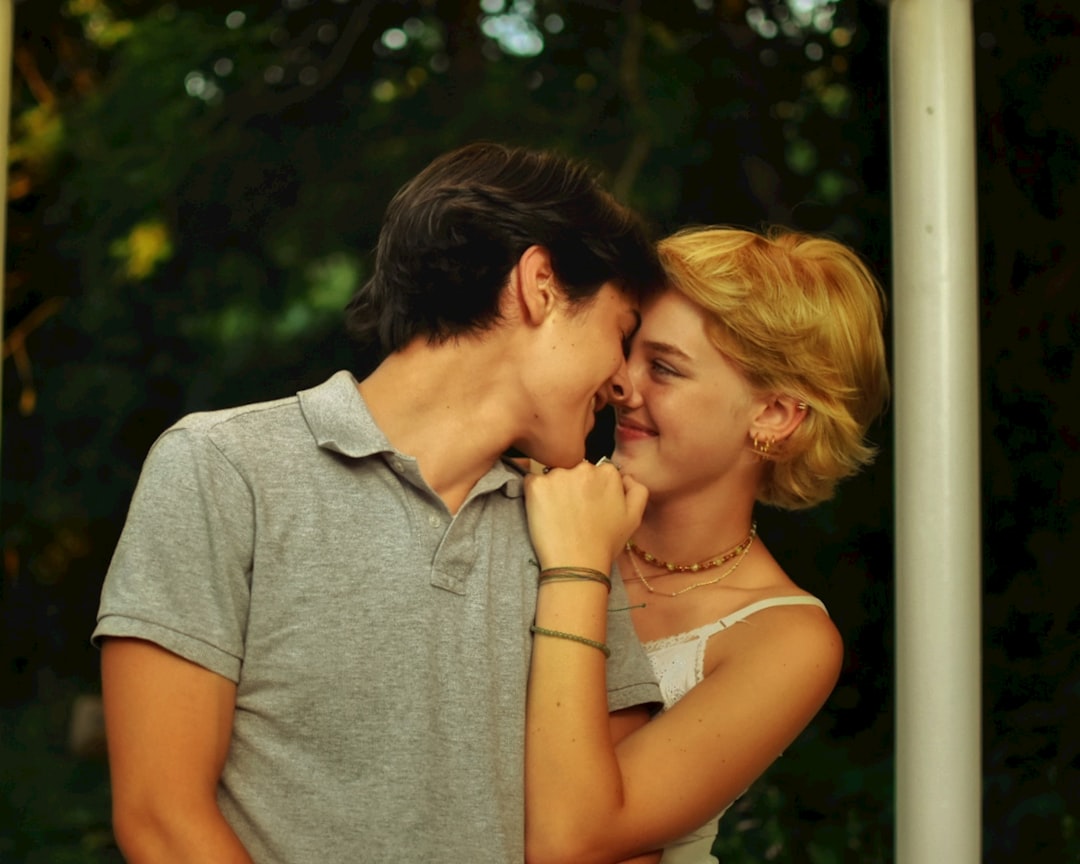 man and woman kissing during daytime