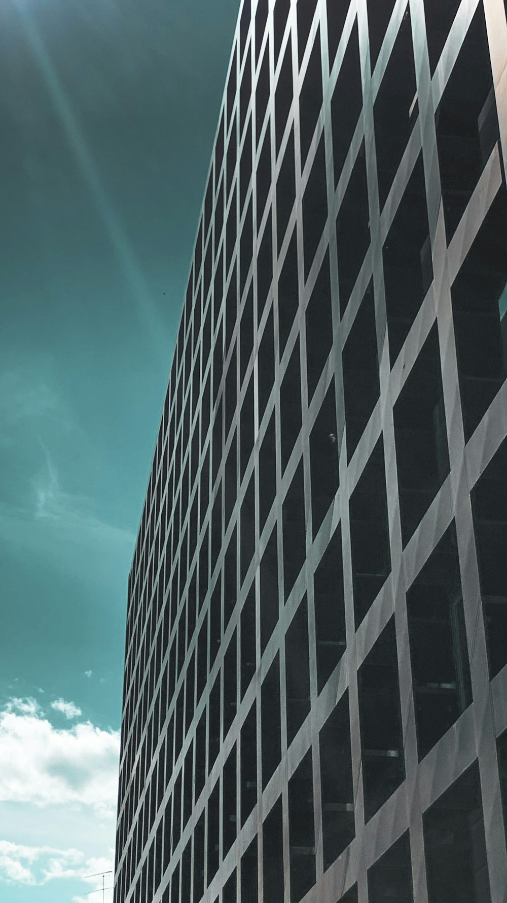 black and white building under blue sky