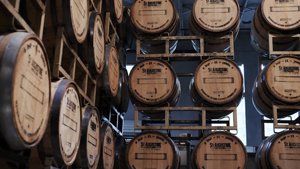 brown wooden barrels on brown wooden shelf