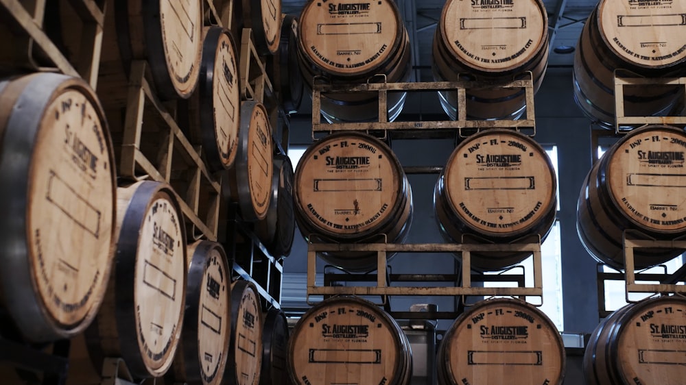 brown wooden barrels on brown wooden shelf