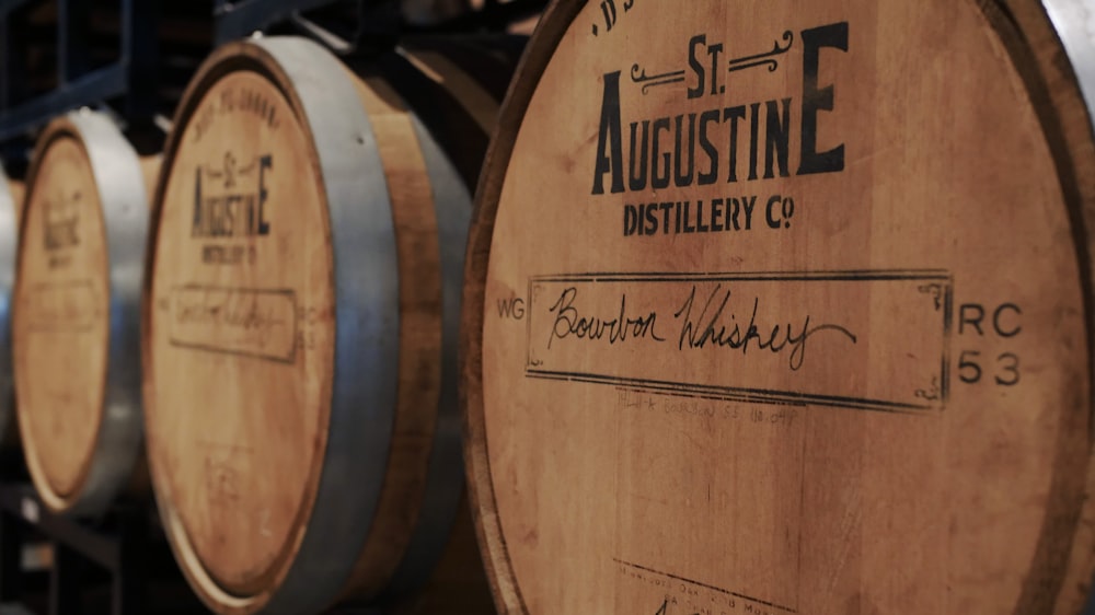 a row of wooden barrels sitting next to each other