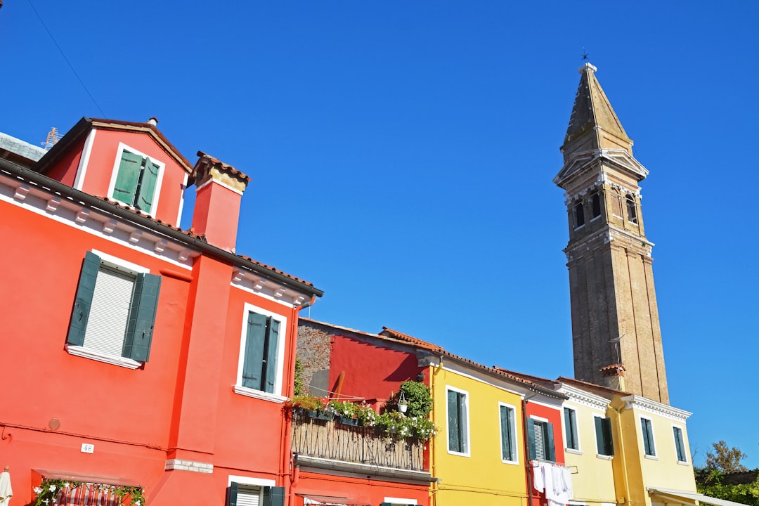 red and white concrete building under blue sky during daytime