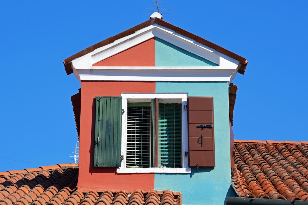 blue and white wooden house under blue sky during daytime