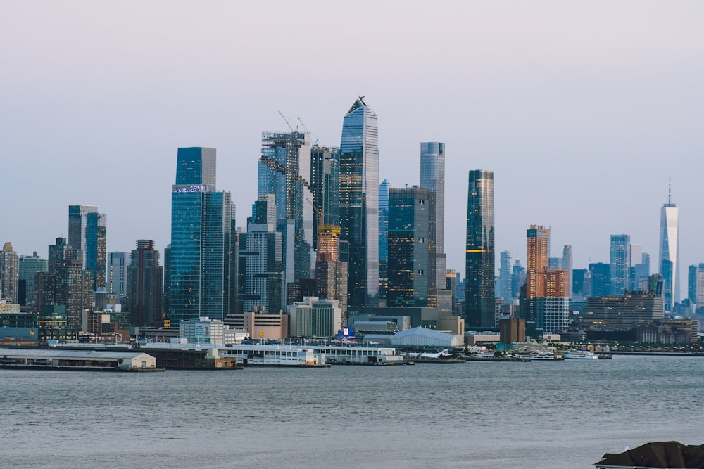 city skyline across body of water during daytime