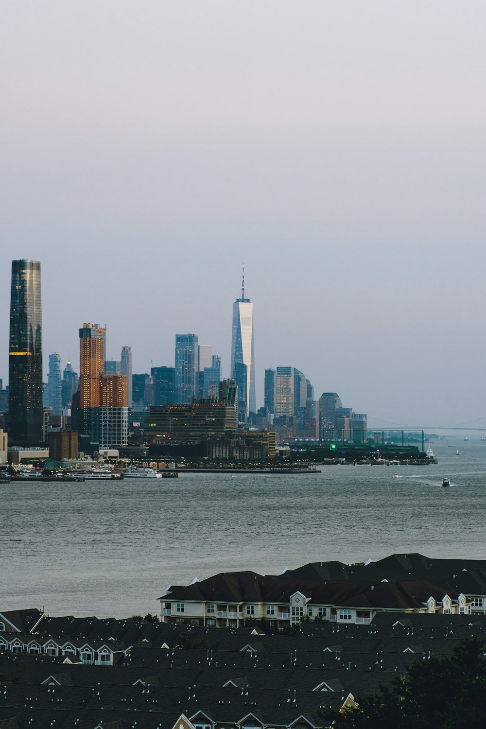 city skyline across body of water during daytime