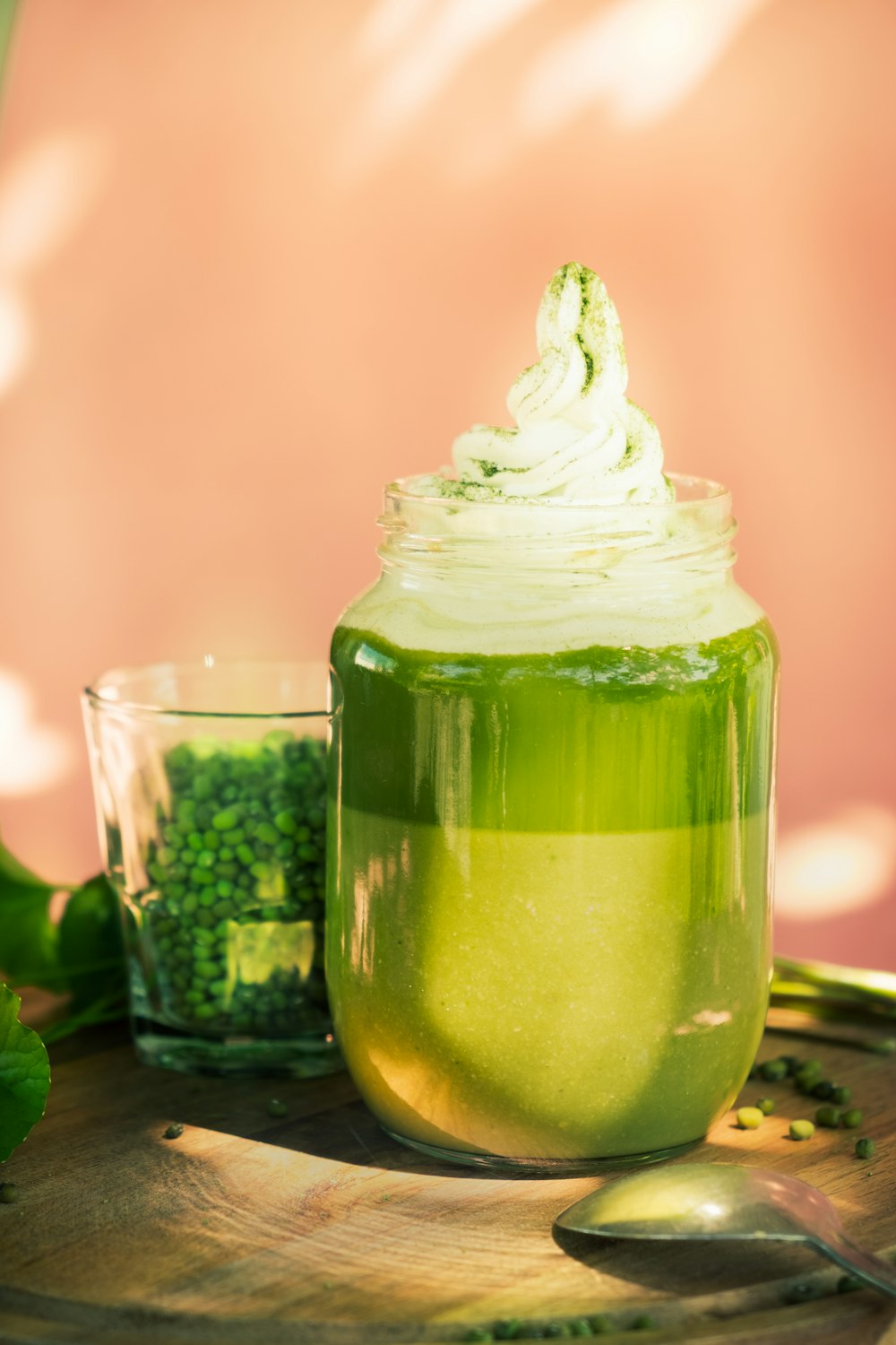 green and white glass jar with white cream