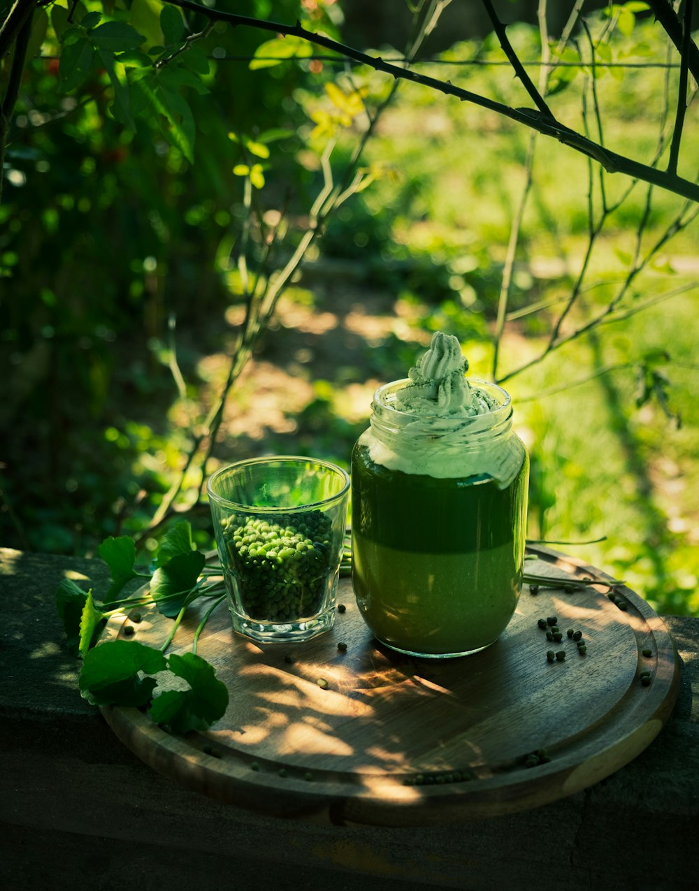 green liquid in clear drinking glass