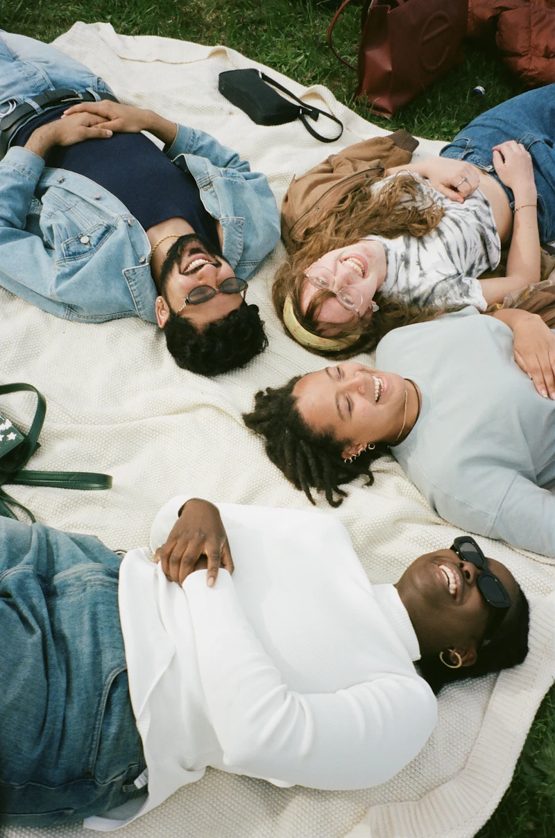 Group of friends laughing together outdoors