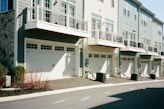 white concrete building beside road during daytime