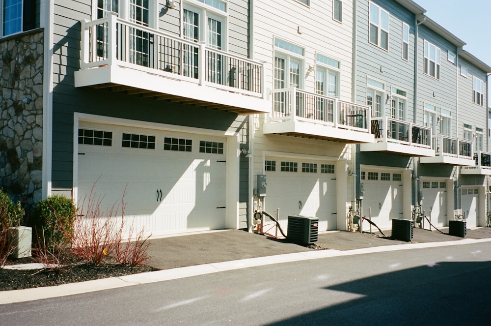 white concrete building beside road during daytime