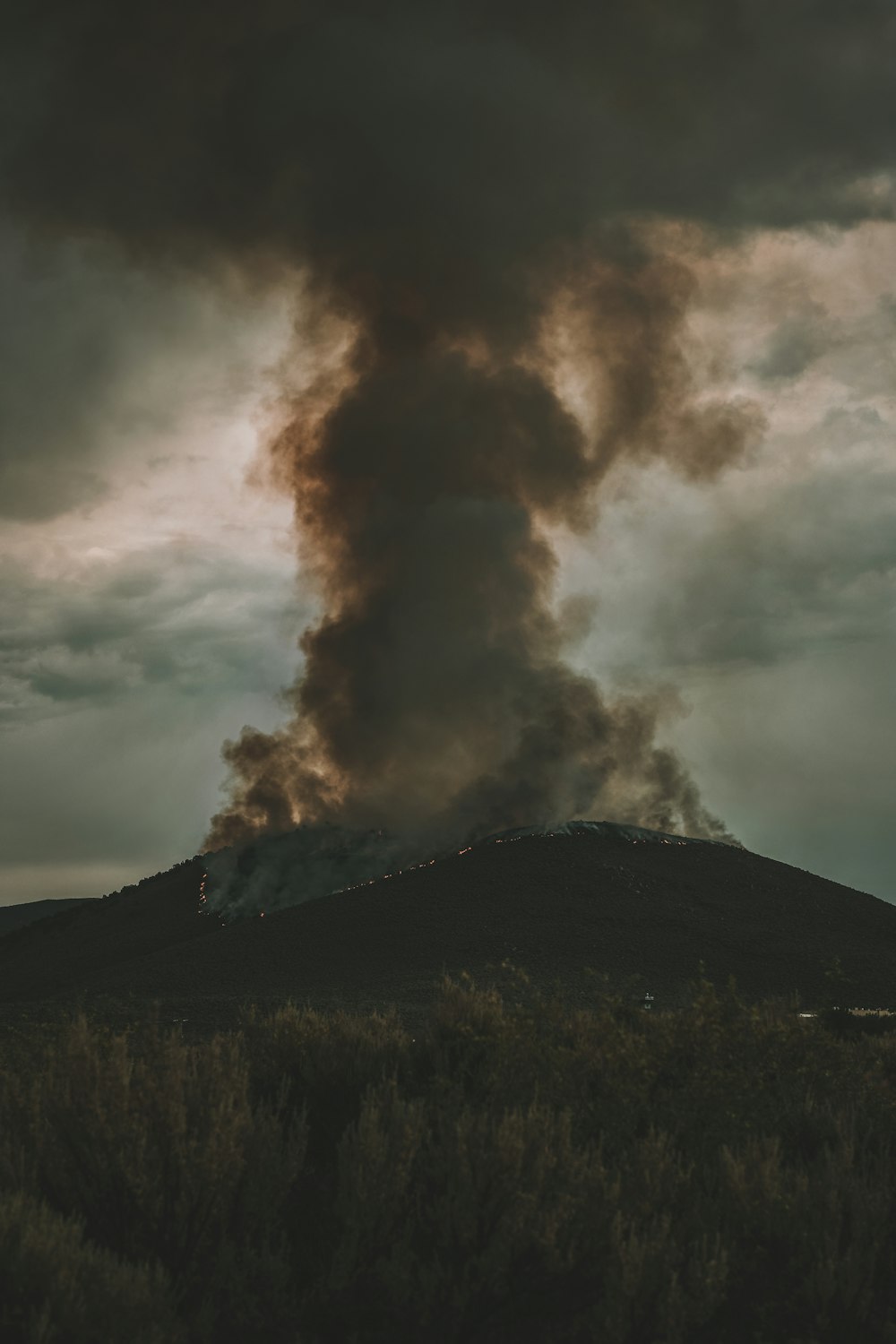 black mountain under white clouds