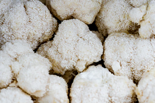 white cotton on brown wooden table
