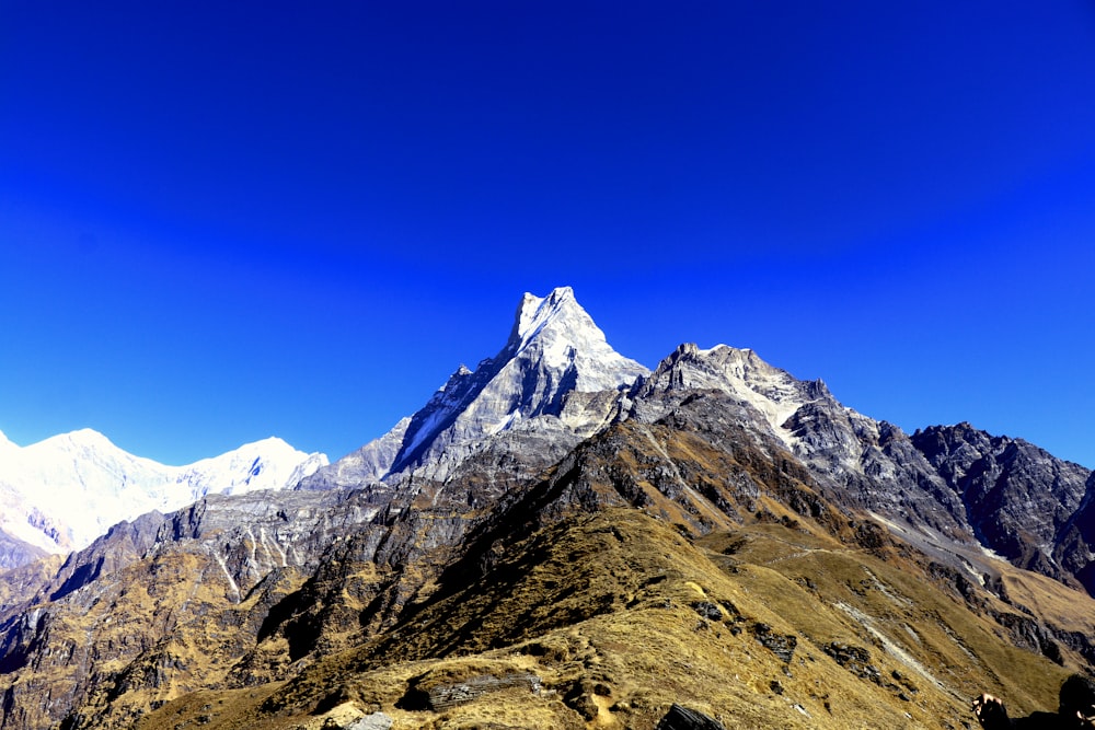 brown and white rocky mountain under blue sky during daytime