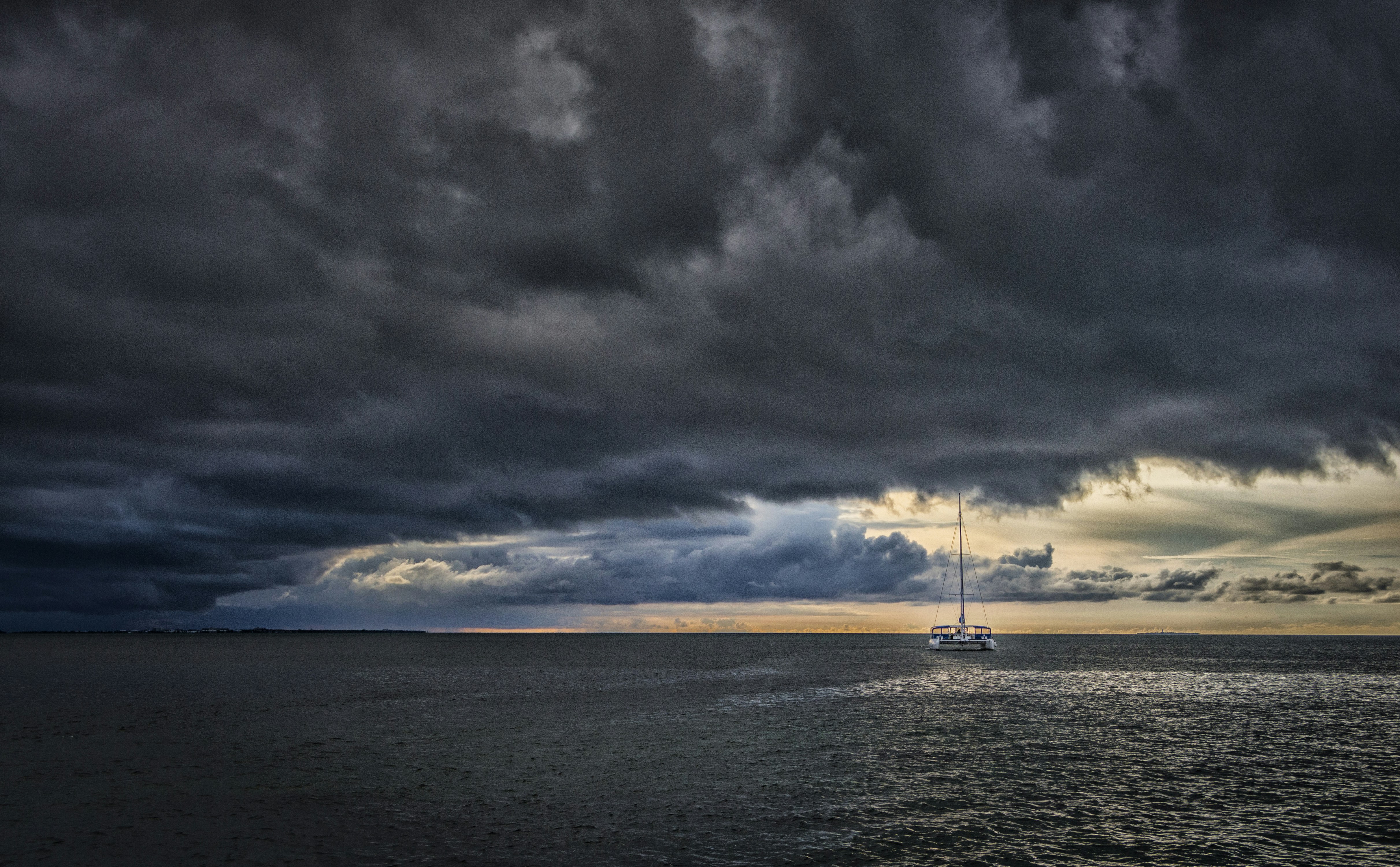 body of water under cloudy sky during daytime