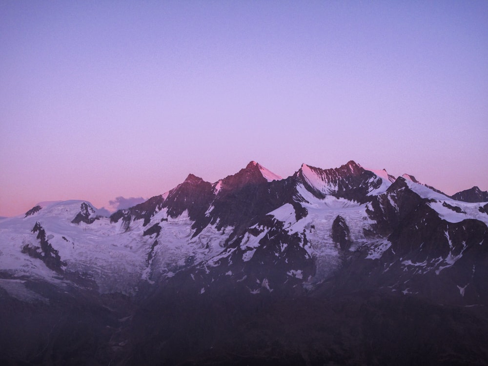 snow covered mountain during daytime