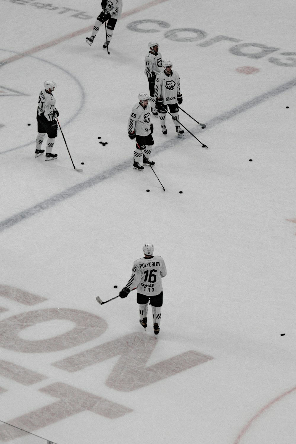 2 men playing ice hockey