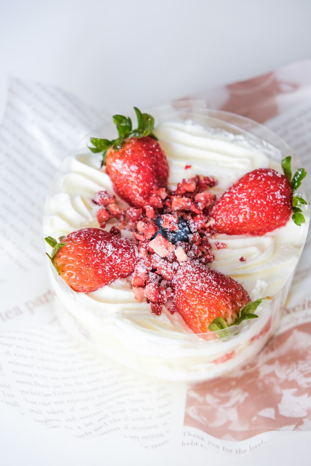 strawberries on clear glass bowl