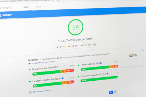 A speedometer graphic symbolizing fast website loading times on various devices.