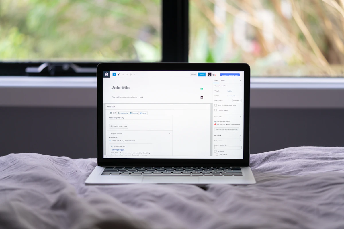 Macbook pro on white bed