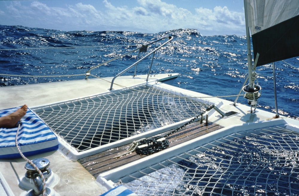 white and black boat on sea during daytime