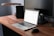 A professional person working on a laptop with LinkedIn open, showcasing a modern workspace.