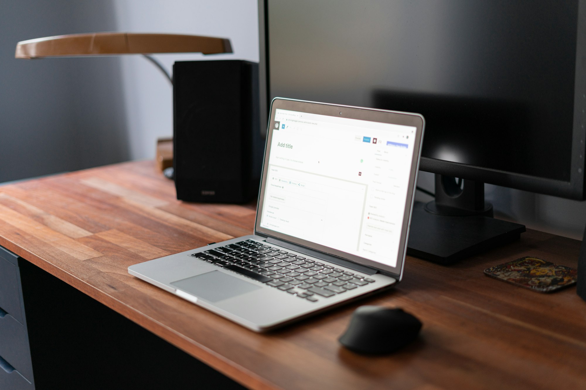 Laptop on a desk with WordPress screen. 