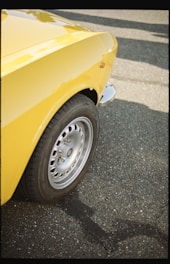 yellow car with gray wheel