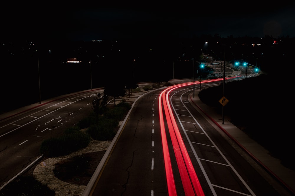 time lapse photography of cars on road during night time