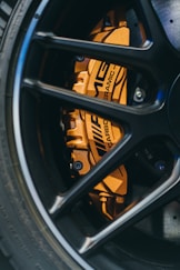 black and yellow wheel with tire
