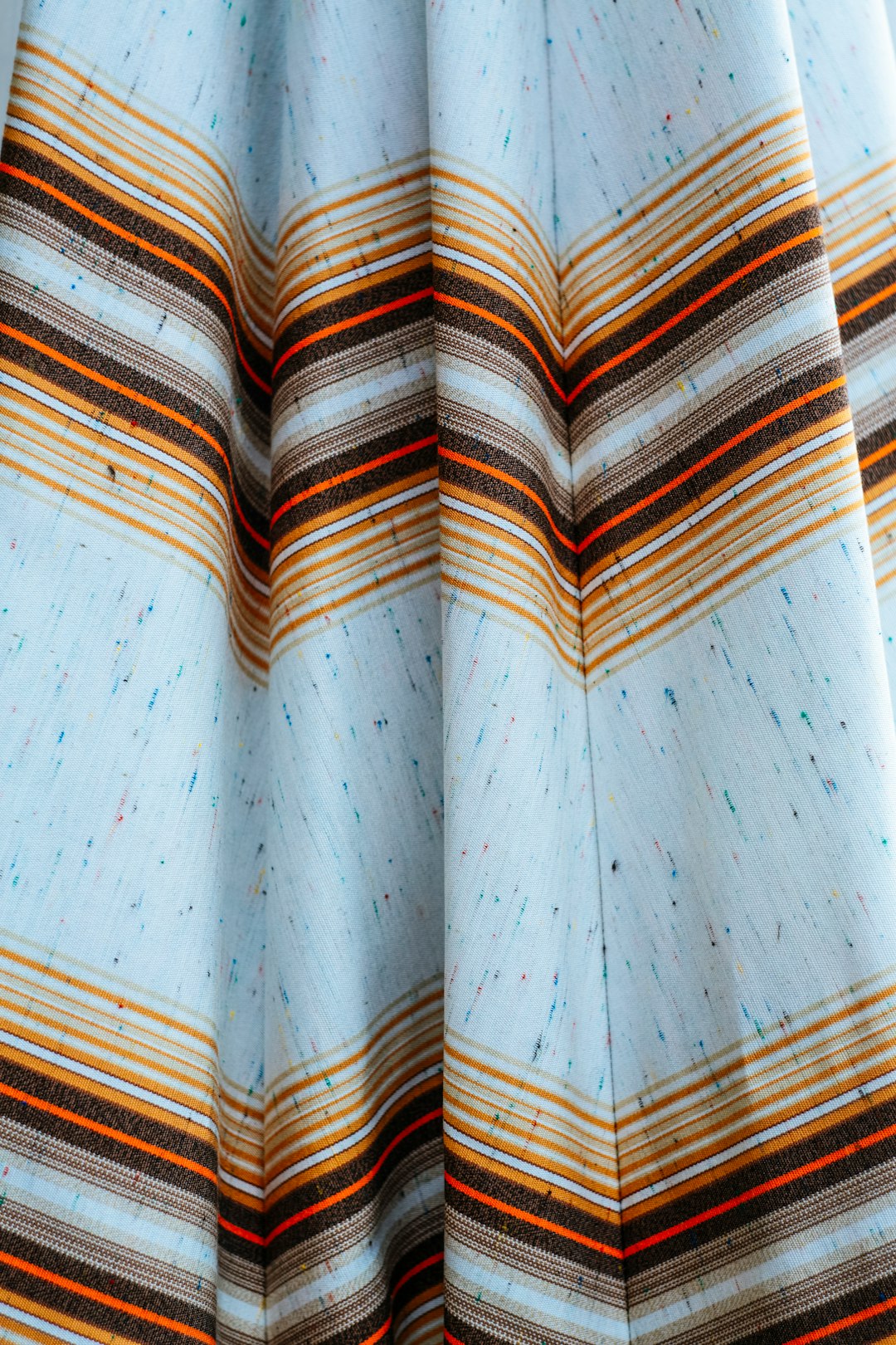 white blue and brown textile