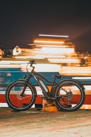 a bicycle is parked on the side of the road