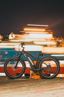 a bicycle is parked on the side of the road