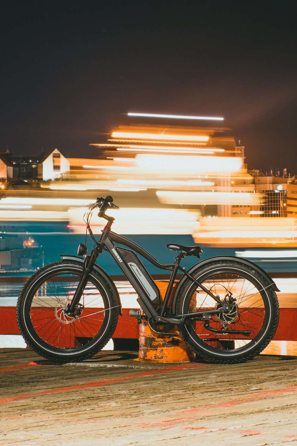 a bicycle is parked on the side of the road