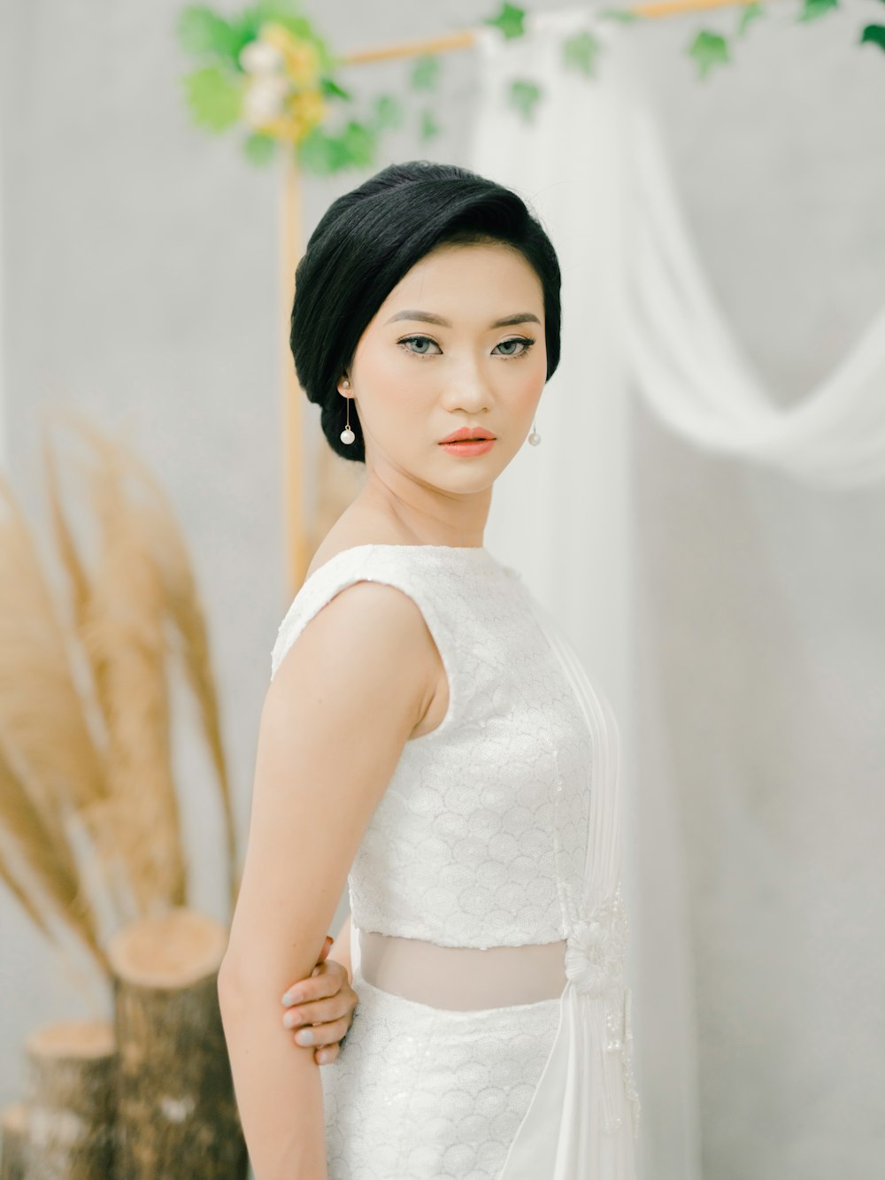 woman in white sleeveless dress
