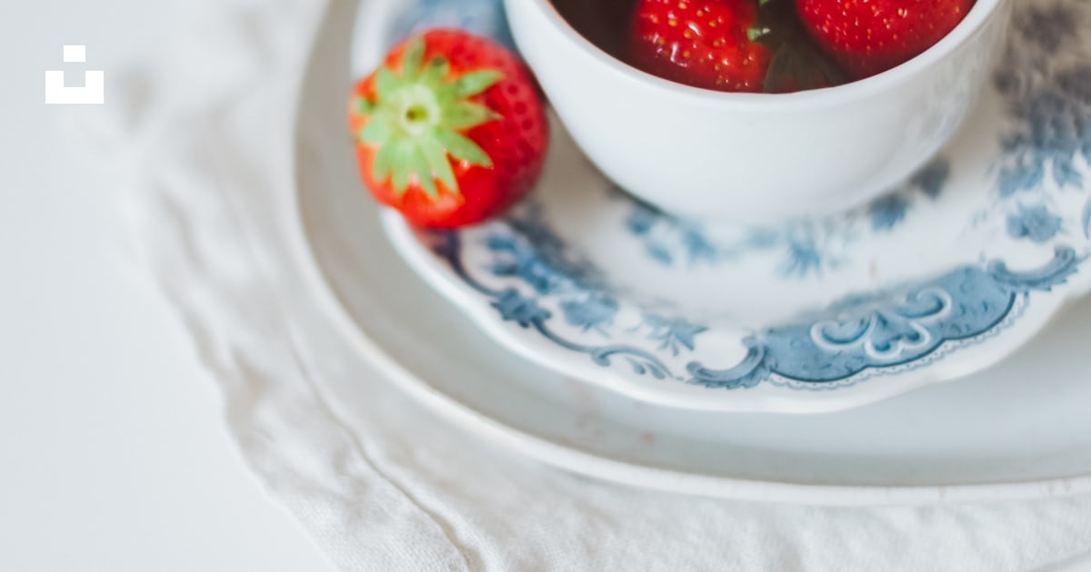 strawberry in white ceramic bowl on white table cloth photo – Free