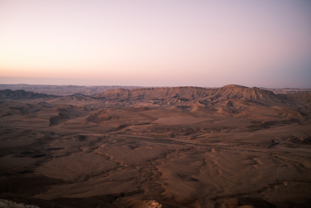 brown mountains under white sky during daytime