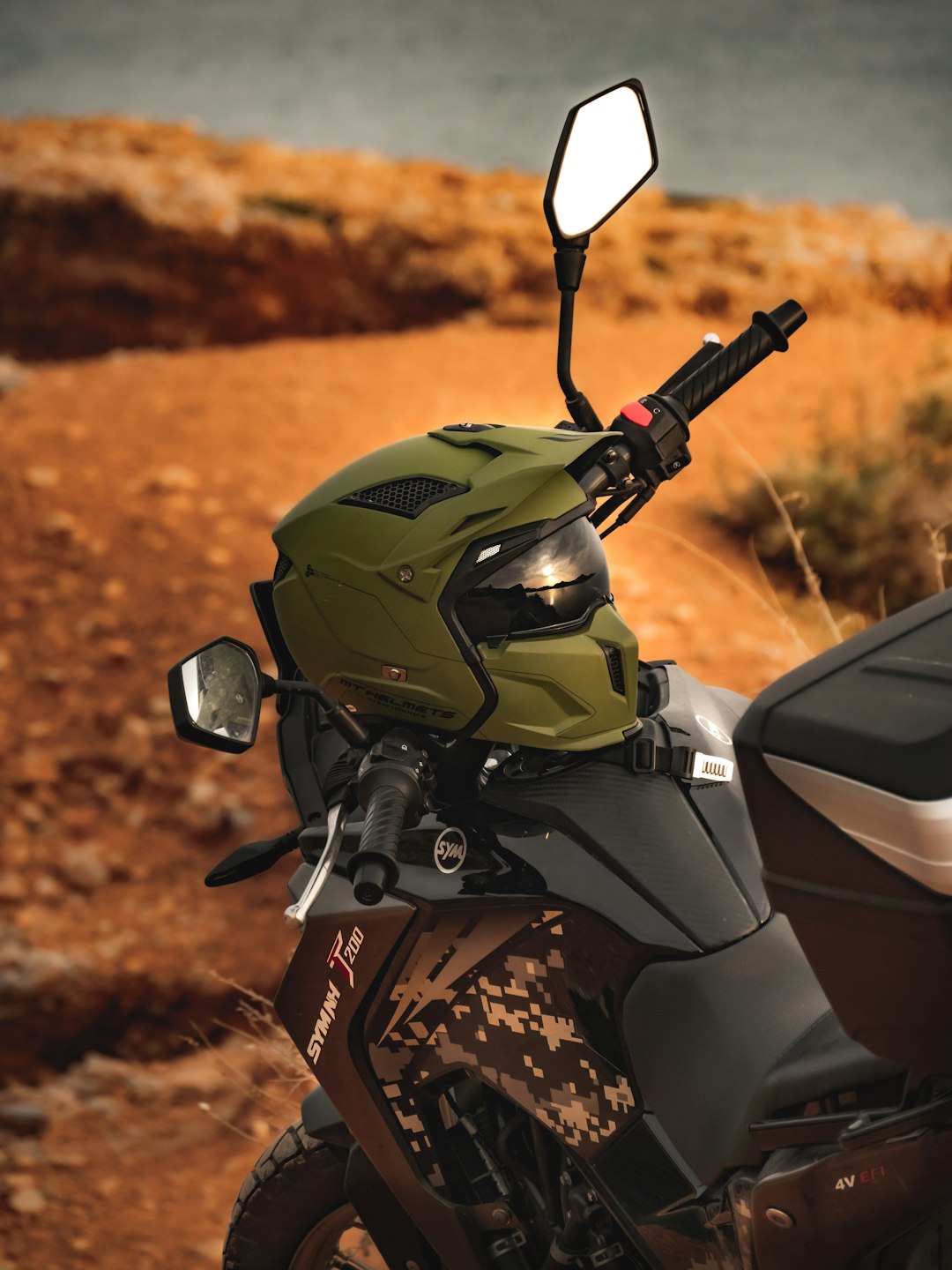 black and gray motorcycle with helmet