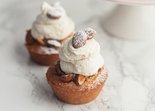 brown and white cupcakes on white ceramic plate