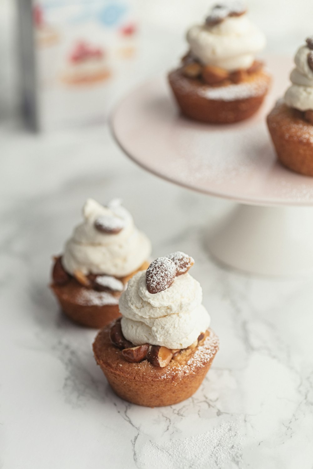 brown and white cupcakes on white ceramic plate