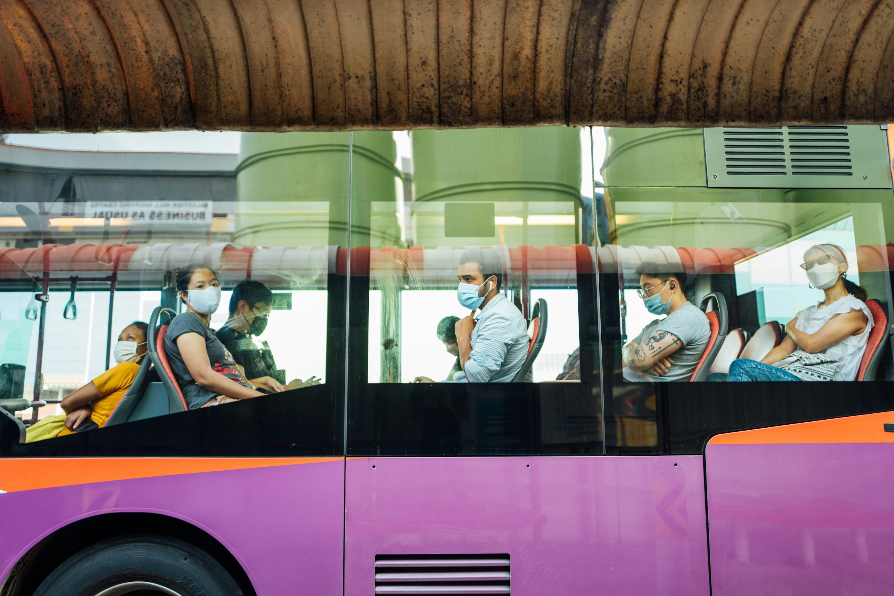 people in a train during daytime