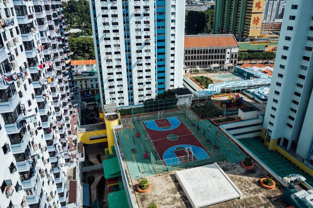 aerial view of basketball court surrounded by buildings during daytime