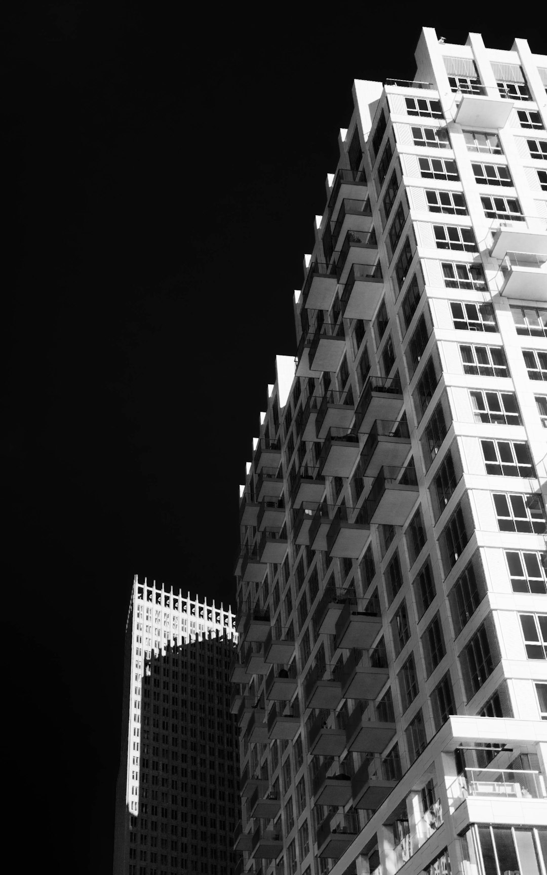 grayscale photo of high rise building