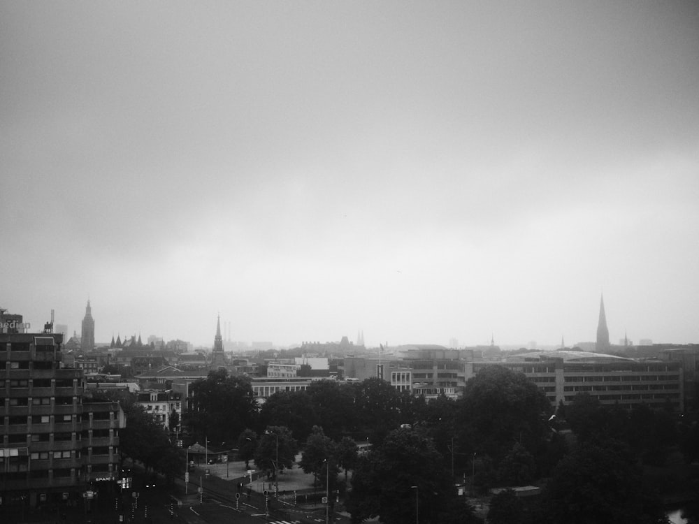 grayscale photo of city buildings