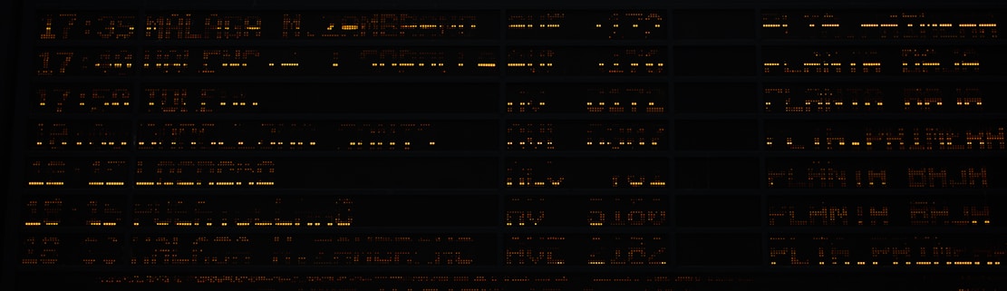 A bright orange background with contact information.