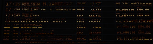 Pixel art patch notes timeline displayed with ember red text on near-black background.