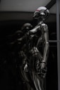 stainless steel robot toy in close up photography