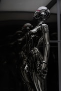 stainless steel robot toy in close up photography