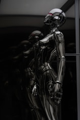 stainless steel robot toy in close up photography